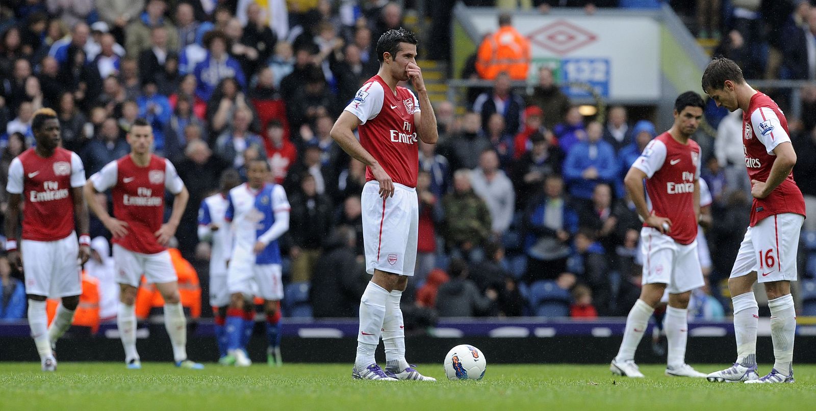 Arsenal's players react after Blackburn Rovers' Yakubu (unseen) scored during their English Premier League soccer match in Blackburn