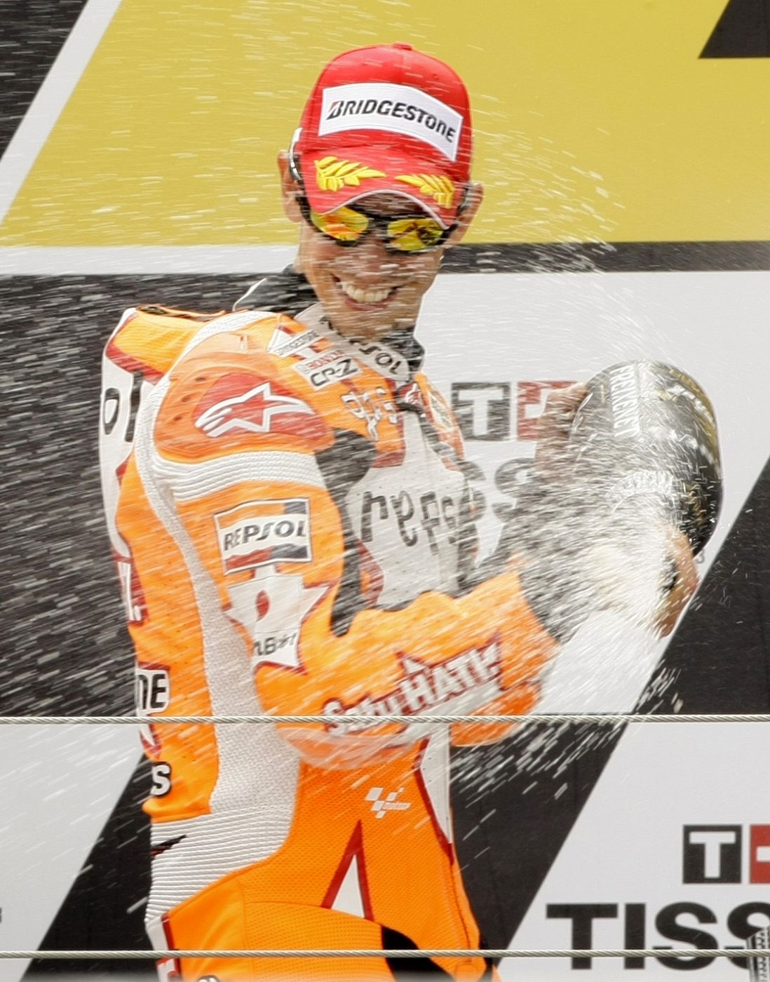 Honda MotoGP rider Casey Stoner of Australia sprays cava after his victory at the Aragon Grand Prix at Motorland race track in Alcaniz