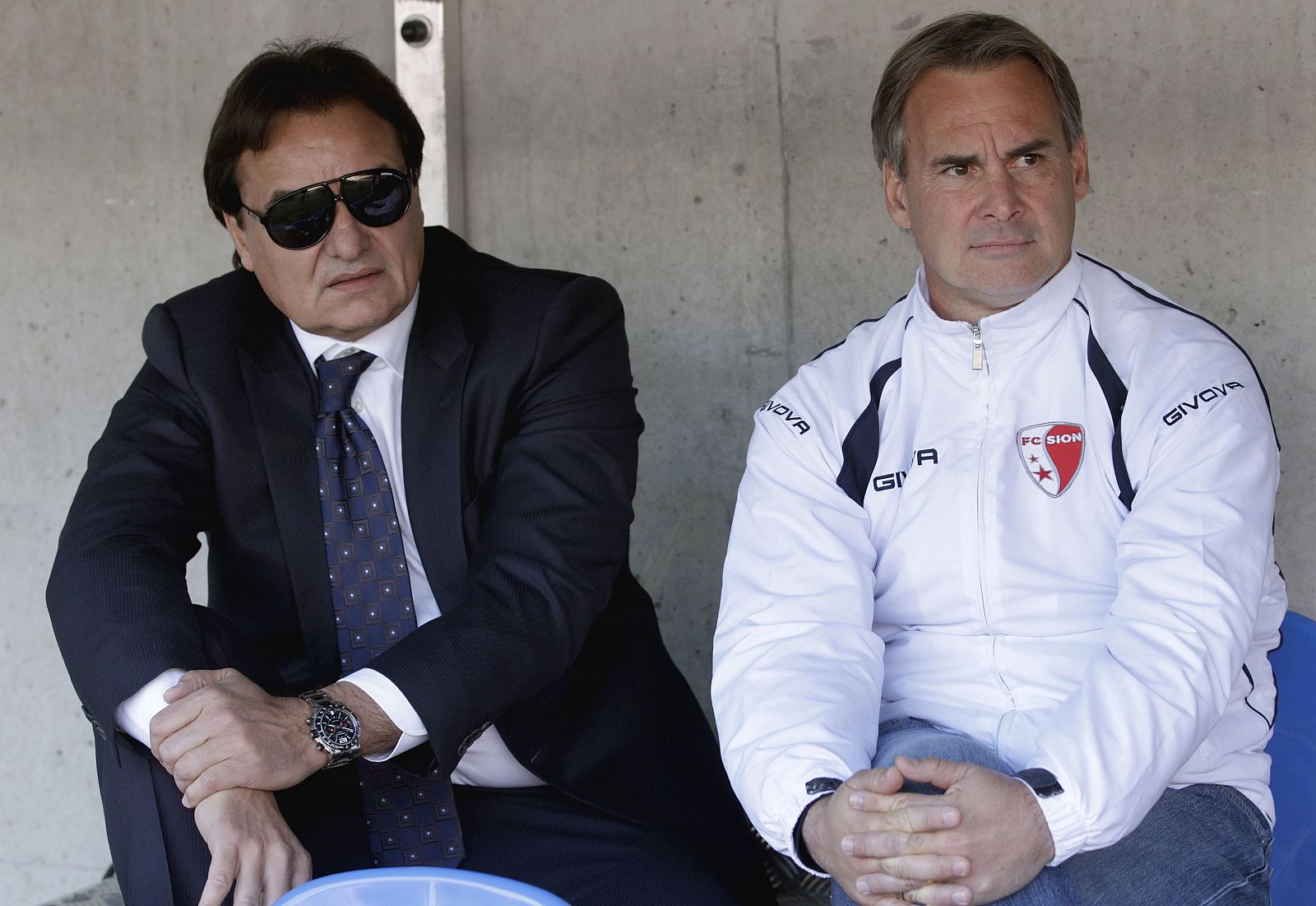 FC Sion's President Constantin sits with the club's trainer Roussey before their Super League soccer match against FC Servette in Geneva