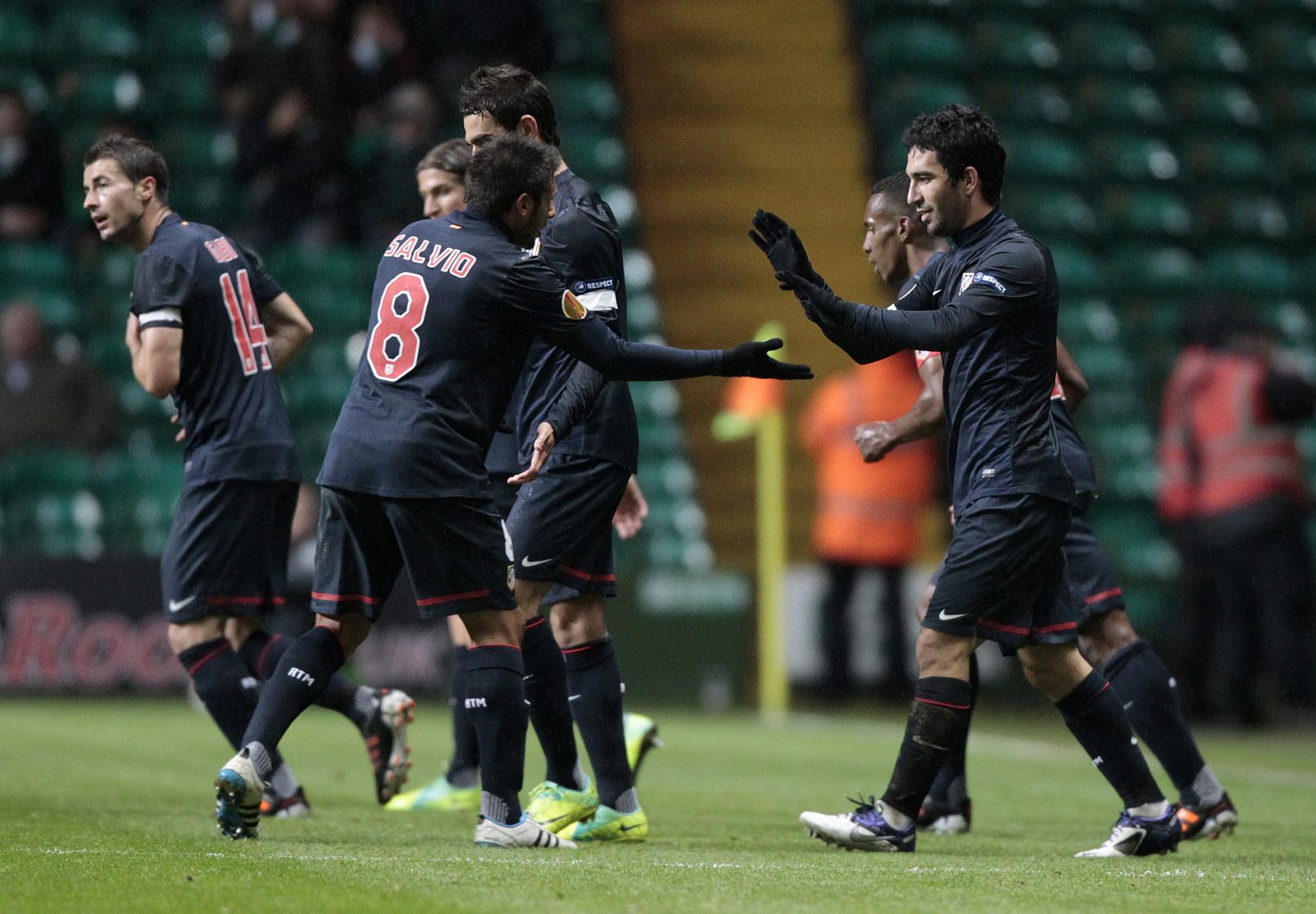 Atletico Madrid's  Turan celebrates with teammates after scoring against Celtic during their Europa League Group I soccer match at Celtic Park stadium in Glasgow