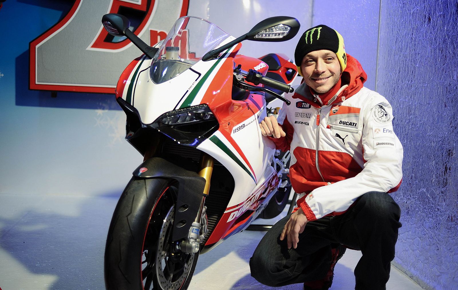 Ducati Moto GP rider Valentino Rossi poses with Ducati 1199 Panigale as he arrives to take part at the "Wrooom, F1 and MotoGP Press Ski Meeting", Ducati and Ferrari's annual media gathering, in Madonna di Campiglio