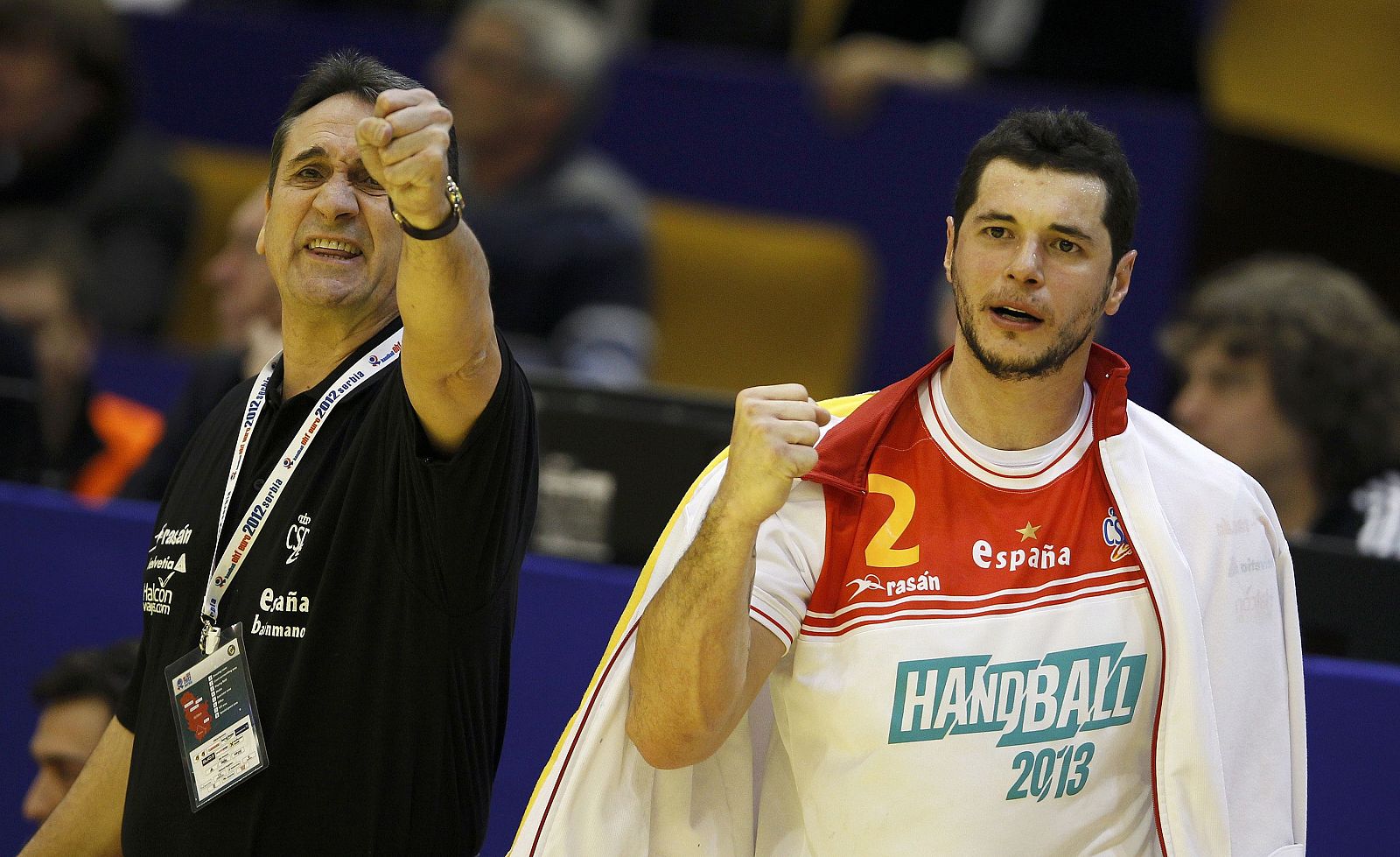 Coach Rivera and Entrerrios of Spain celebrate a goal against France during their men's European Handball Championship Group C match in Novi Sad