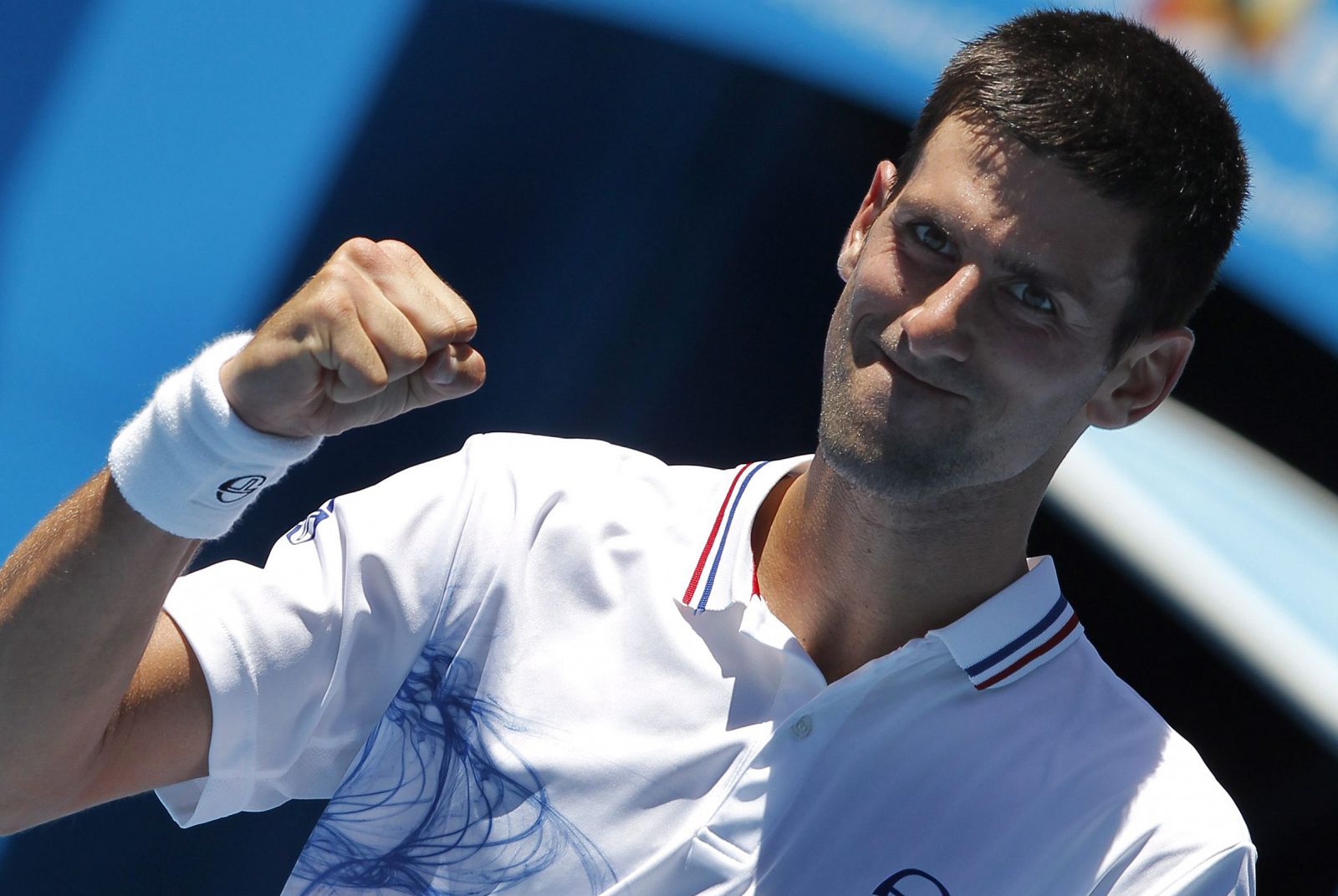 El serbio Novak Djokovic celebra su triunfo sobre el italiano Paolo Lorenzi