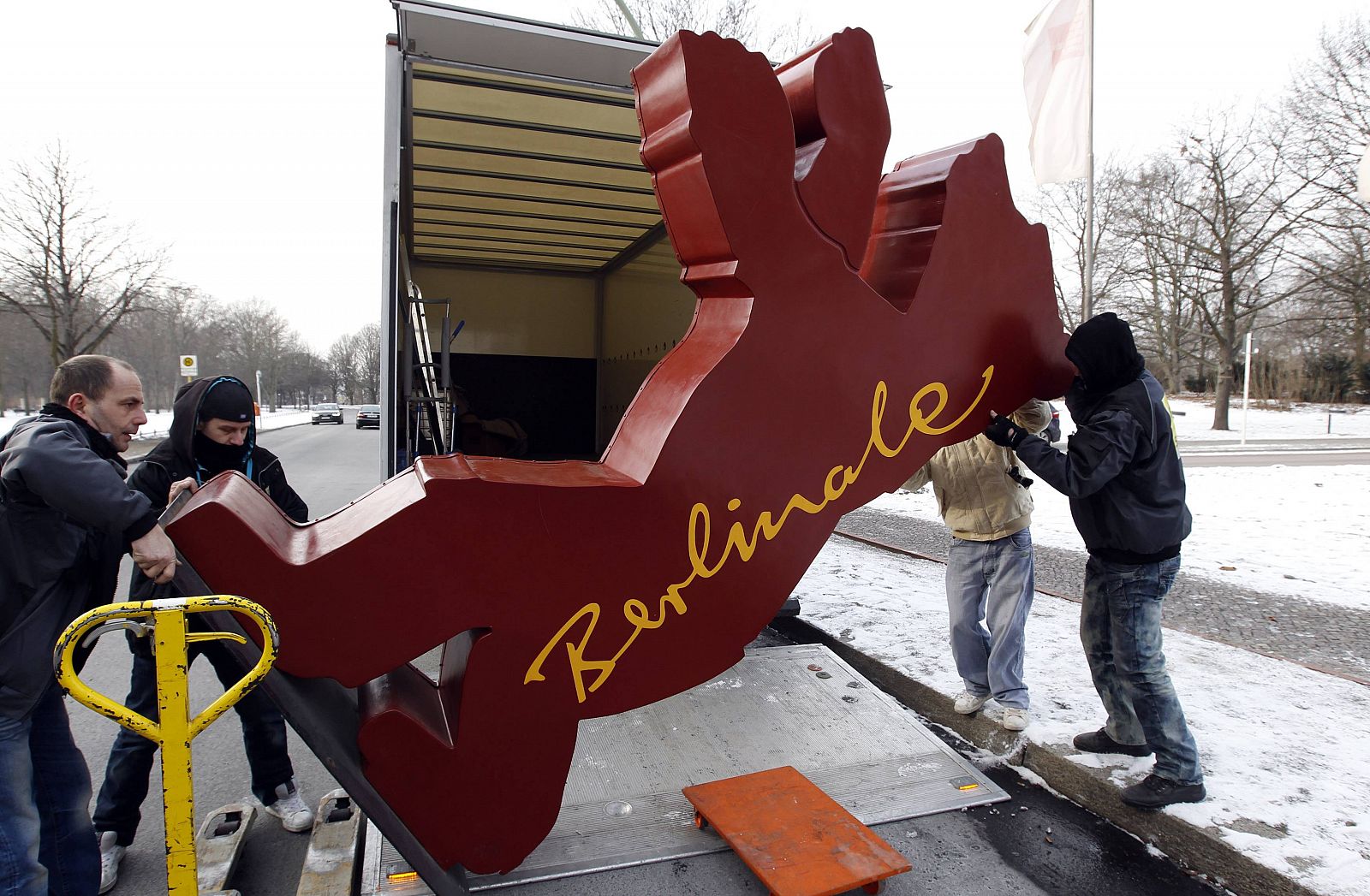 Workers unload the Berlinale International Film Festival logo near the congress hall for the upcoming 62nd Berlinale International Film Festival in Berlin