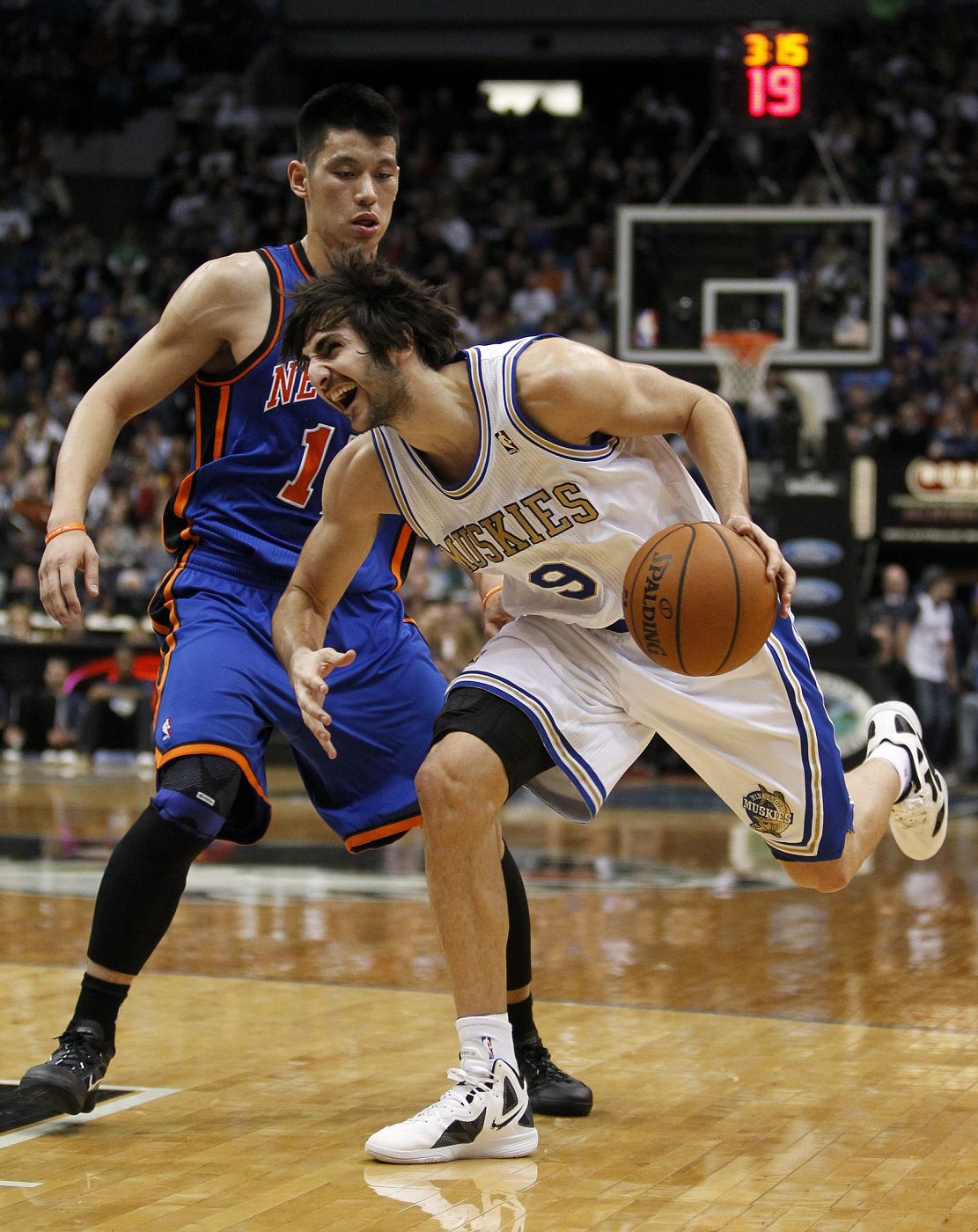 Minnesota Timberwolves guard Ricky Rubio drives past New York Knicks guard Jeremy Lin in Minneapolis