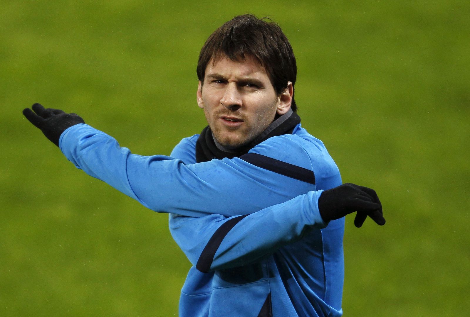 FC Barcelona's Messi warms up during a training session in Leverkusen