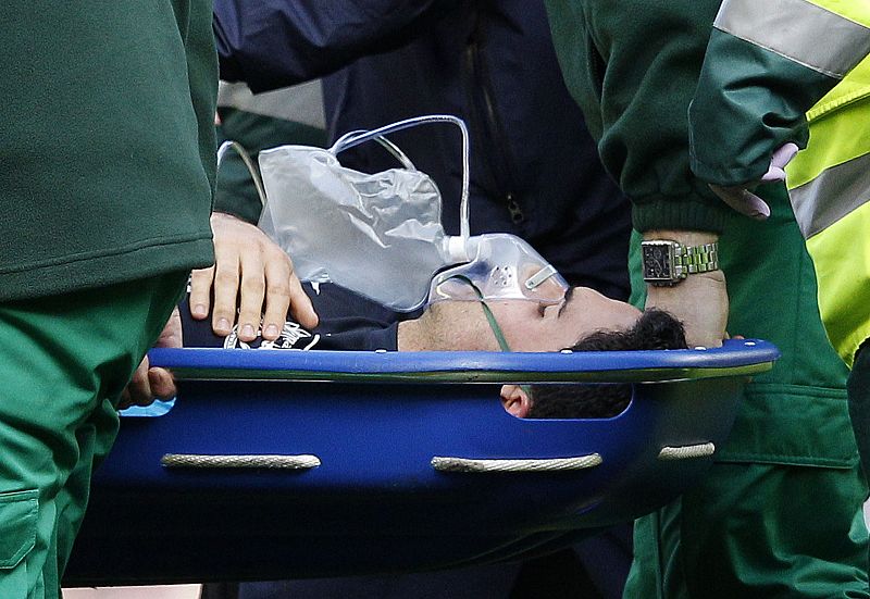 Arsenal's Arteta is carried off the pitch on a stretcher during their English Premier League soccer match against Liverpool in Liverpool