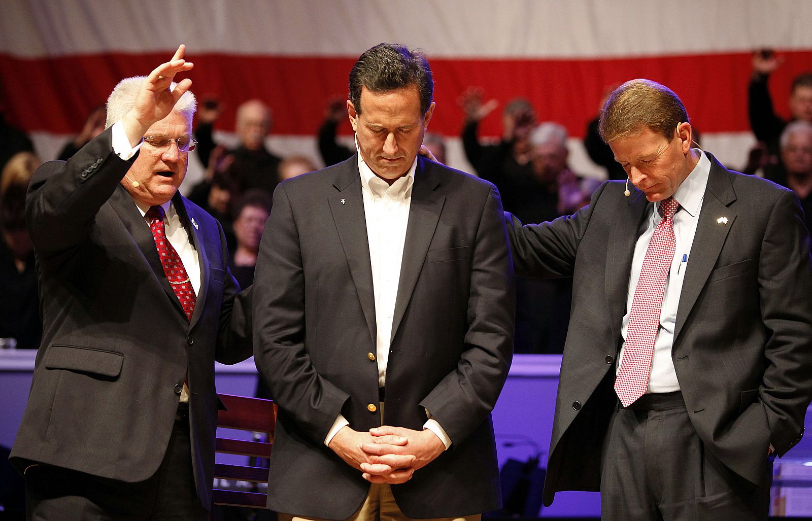 Republican presidential candidate and former U.S. Senator Santorum receives a blessing at Greenwell Springs Baptist Church in Greenwell Springs