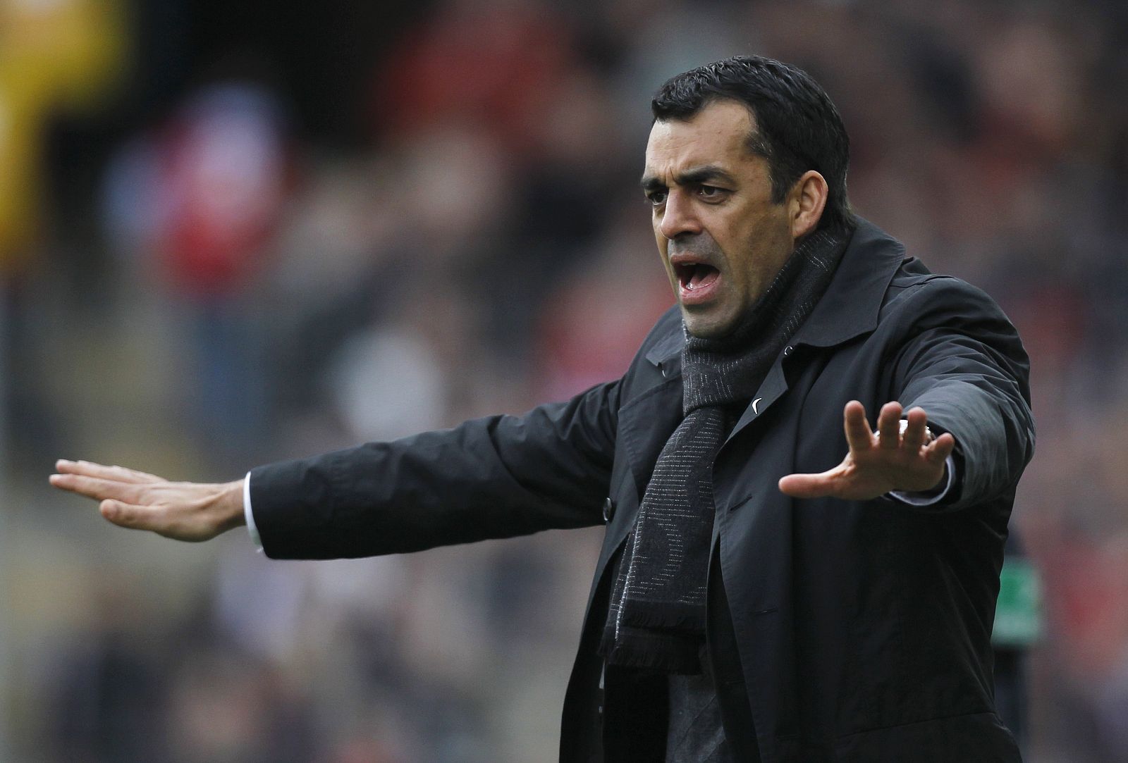 File photo of Leverkusen's coach Dutt gesturing during a German Bundesliga first division soccer match in Freiburg