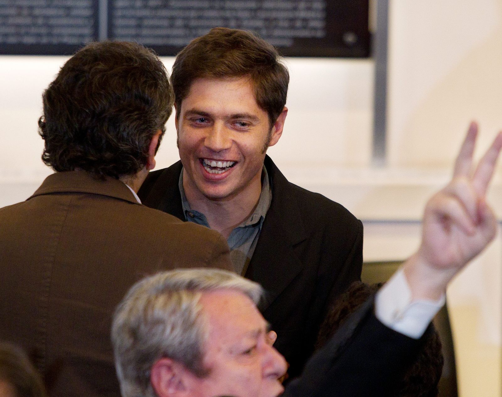 El viceministro de Economía de Argentina, Axel Kicillof, sonríe tras el anuncio de la presidenta.