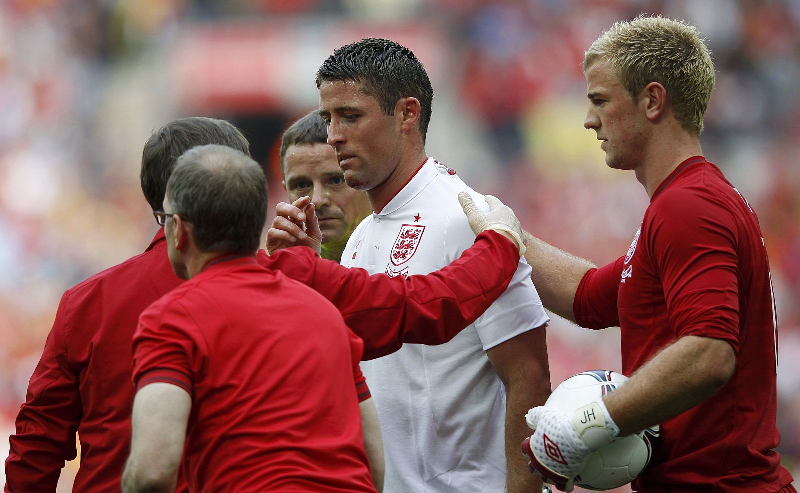 England's Cahill walks off the field after being injured during their international friendly soccer match against Belgium in London