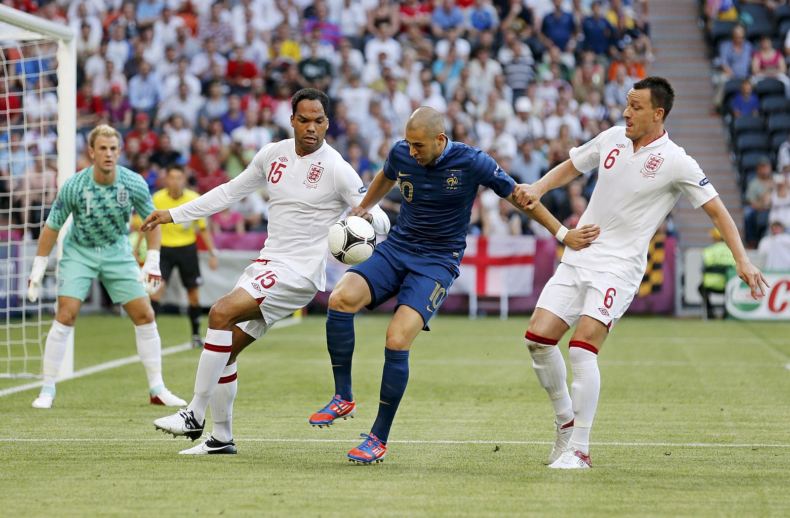 France's Benzema controls the ball next to England's Lescott and Terry during the Group D Euro 2012 soccer match against France at Donbass Arena in Donetsk