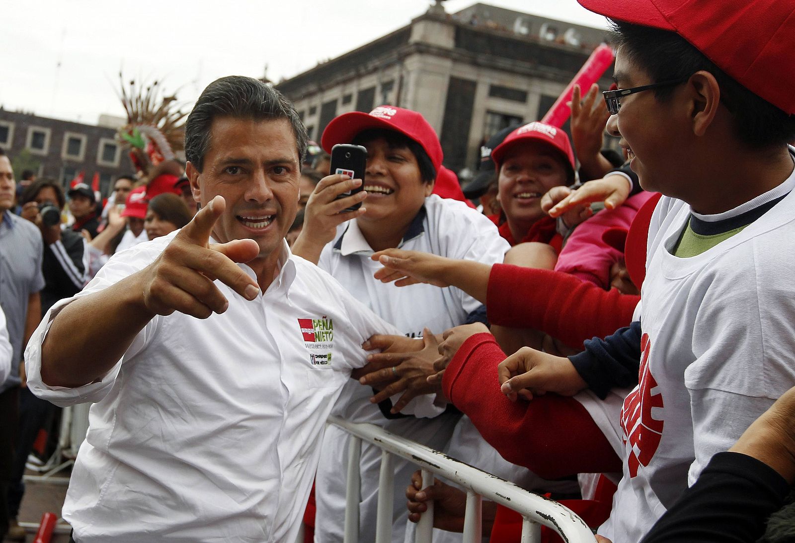 Mexican presidential front-runner Enrique Pena Nieto greets supporters at one of his last campaign rallies in Toluca