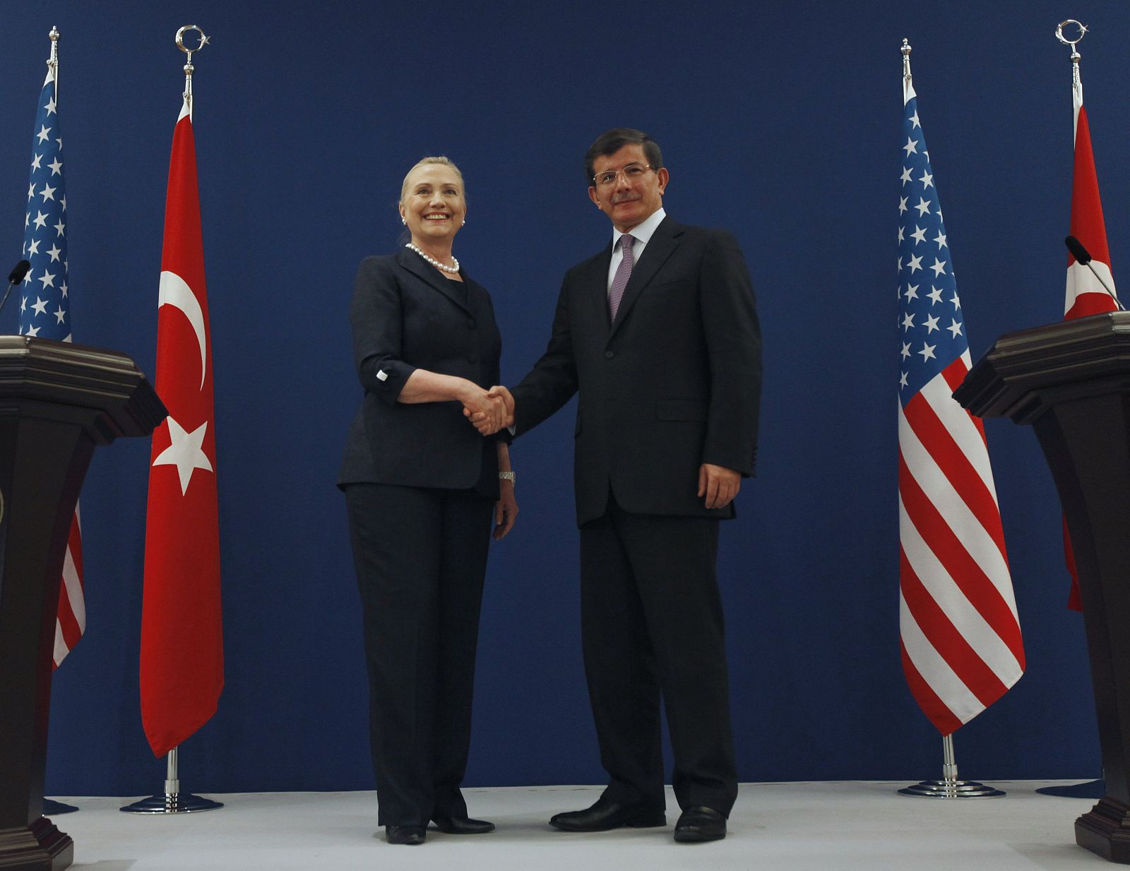 U.S. Secretary of State Clinton and Turkish Foreign Minister Davutoglu pose for the media after their news conference