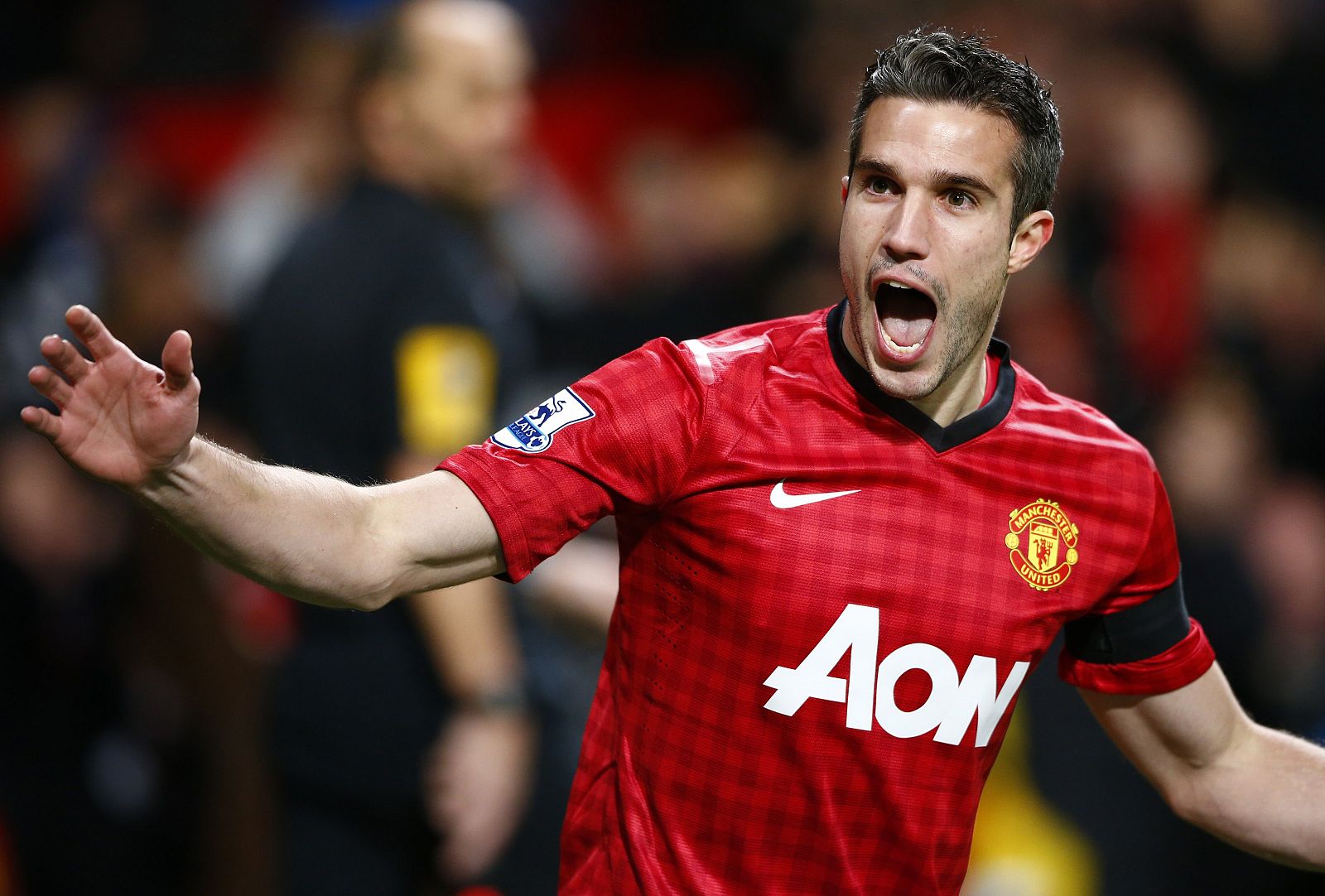 Manchester United's van Persie celebrates his goal against West Ham United during their English Premier League soccer match in Manchester