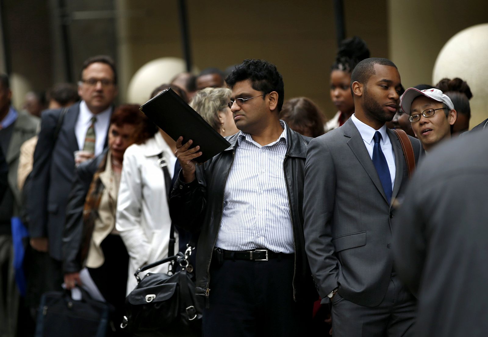 Filer of job seekers standing in line to meet prospective employers at a career fair in New York City