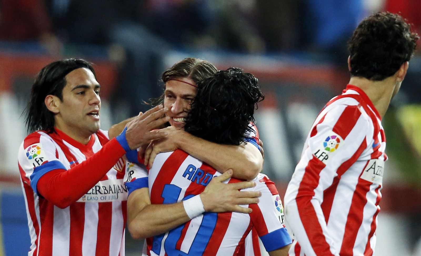 Filipe Luis, Falcao y Arda Turan celebran el segundo gol rojiblanco.