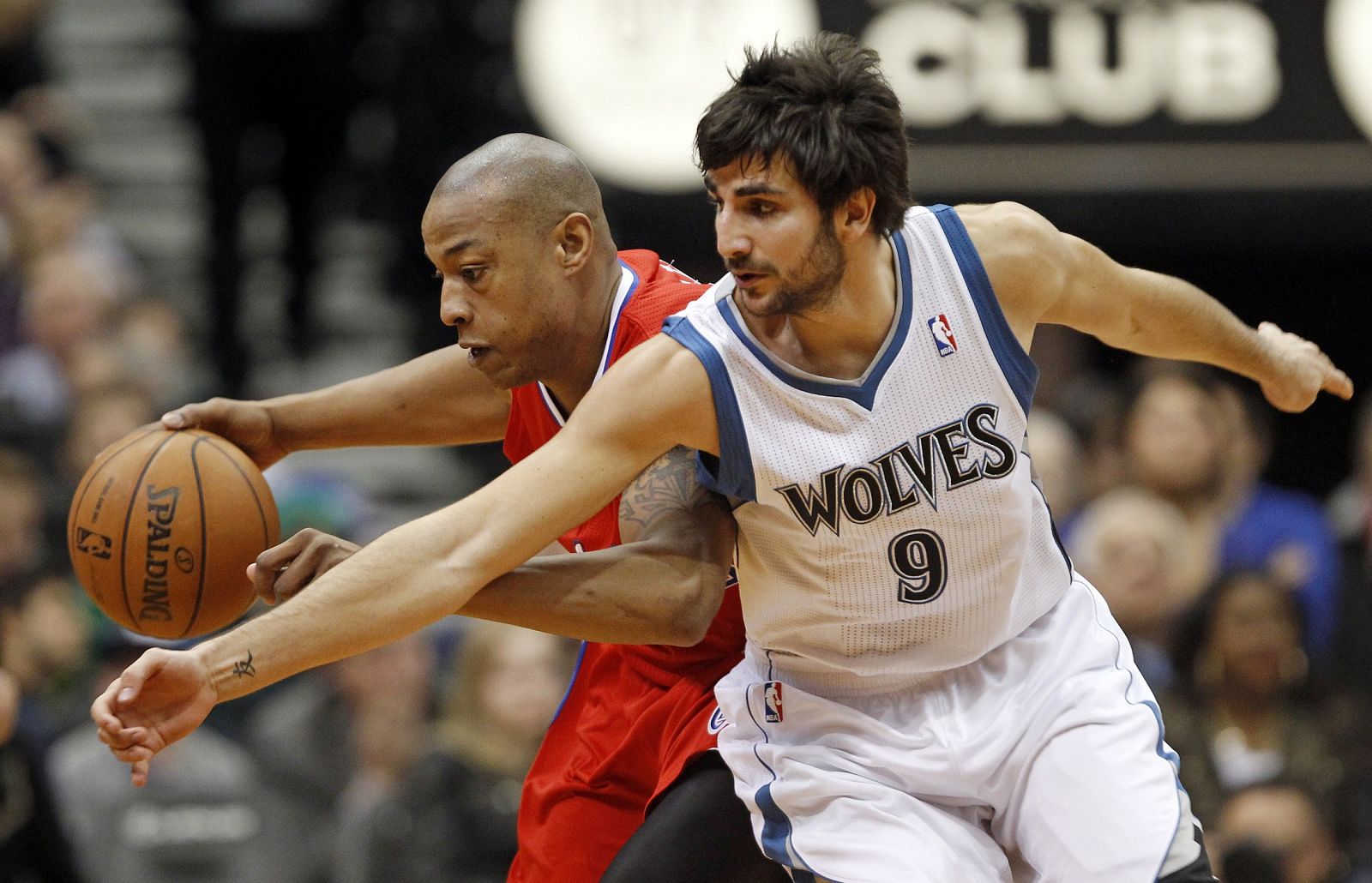 L.A. Clippers forward Caron Butler is fouled by Minnesota Timberwolves guard Ricky Rubio during the second half of their NBA basketball game in the Target Center in Minneapolis,