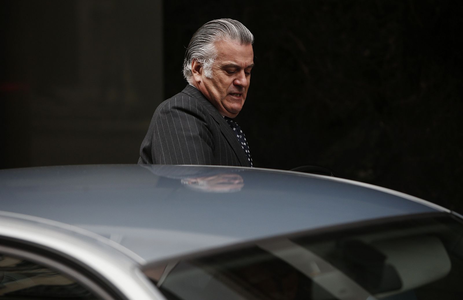 Former People's Party treasurer Barcenas enters a car as he leaves Spain's High Court after appearing before a judge in Madrid