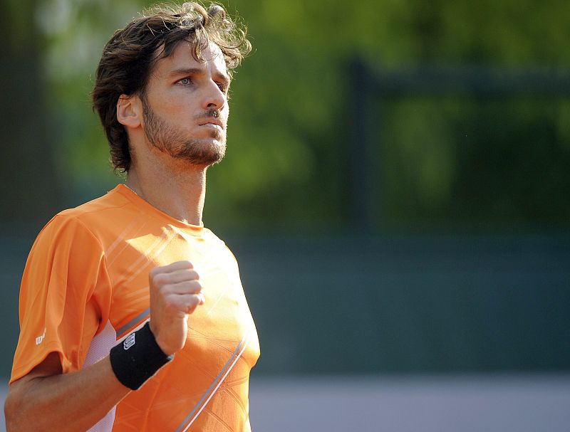 Feliciano López celebra un punto ante Marcel Granollers