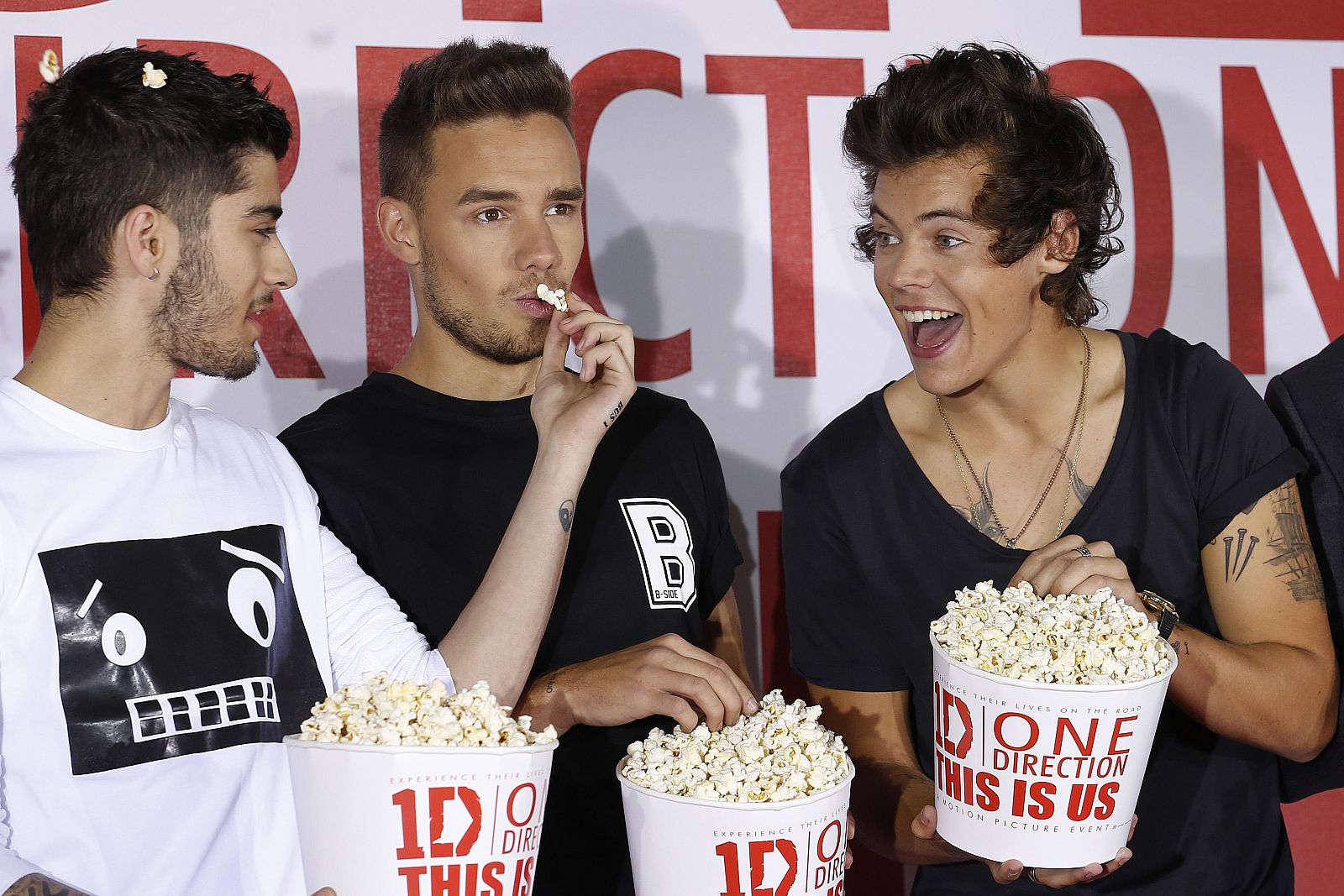 Members of the music group One Direction Zayne Malik, Liam Payne and Harry Styles pose for photographers during a photocall for their film 'One Direction; This is Us' in London