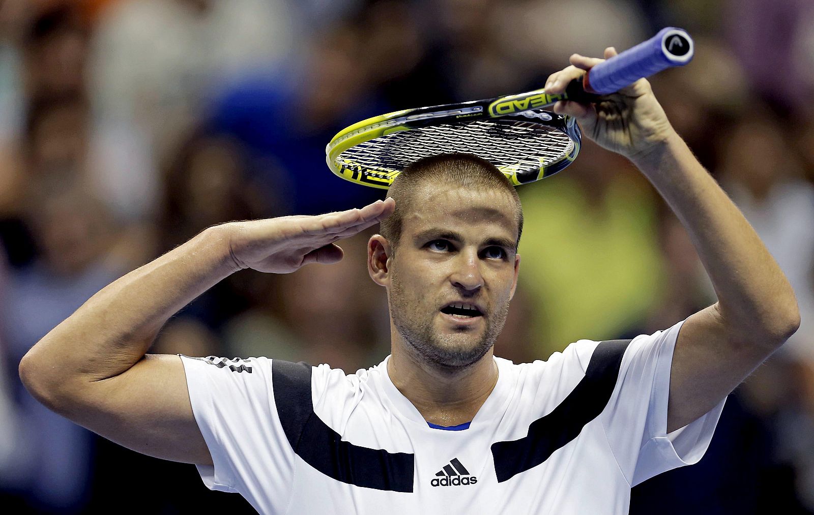 El tenista ruso Mikhail Youzhny celebra su victoria ante el alicantino David Ferrer.