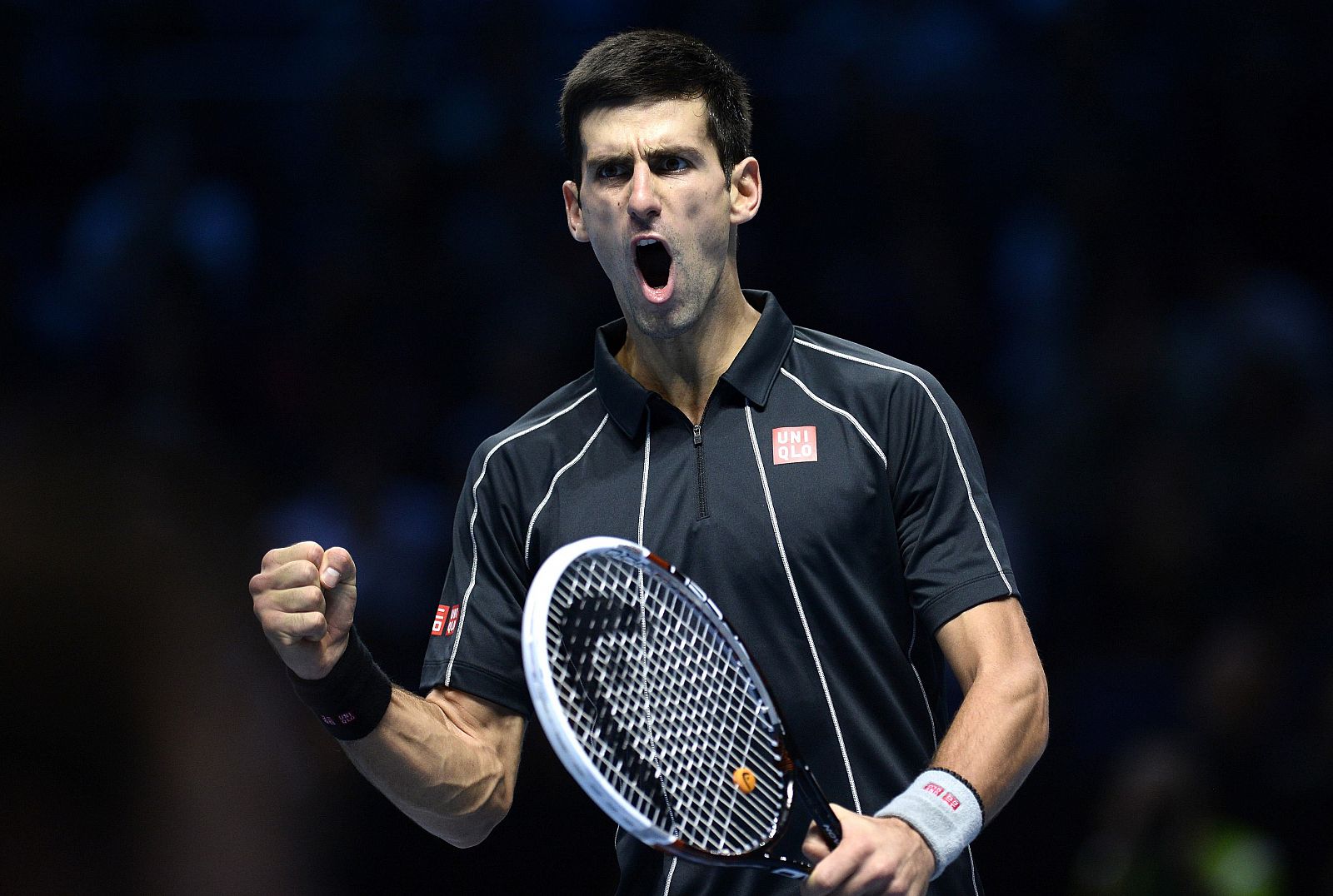 Novak Djokovic of Serbia celebrates wining a point against Stanislas Wawrinka of Switzerland in their men's semi-final singles tennis match in London