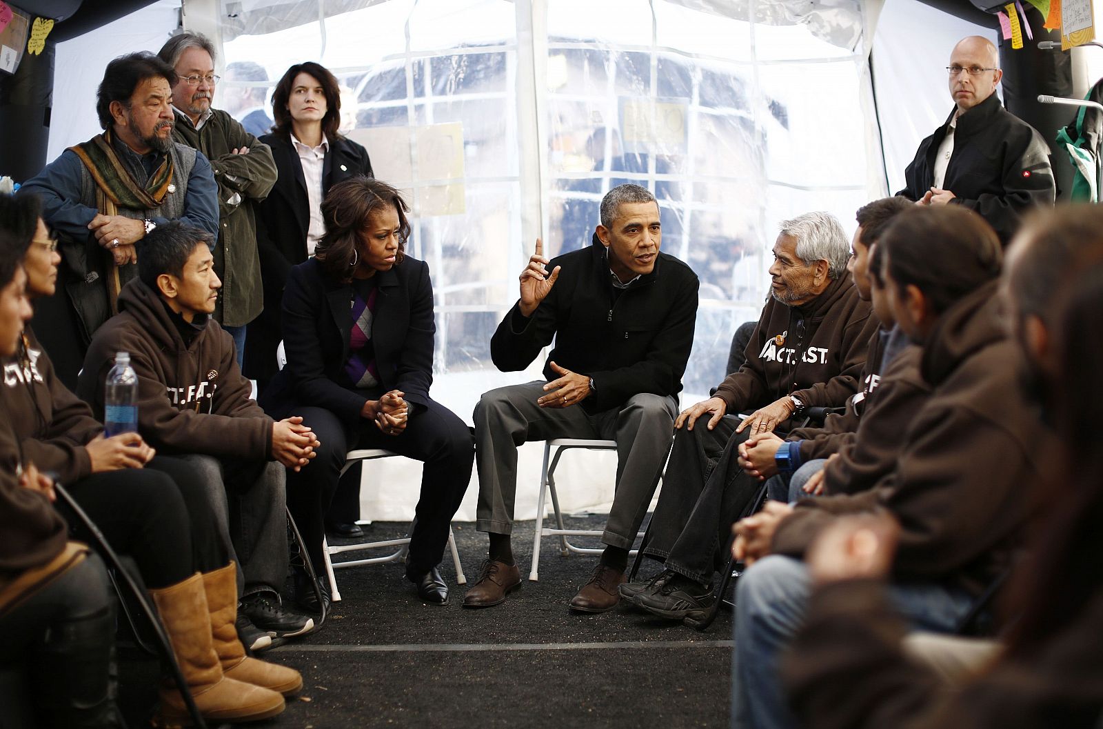 U.S. President Barack Obama and first lady Michelle Obama meet with protesters fasting for immigration reform in a tent on the Washingon Mall