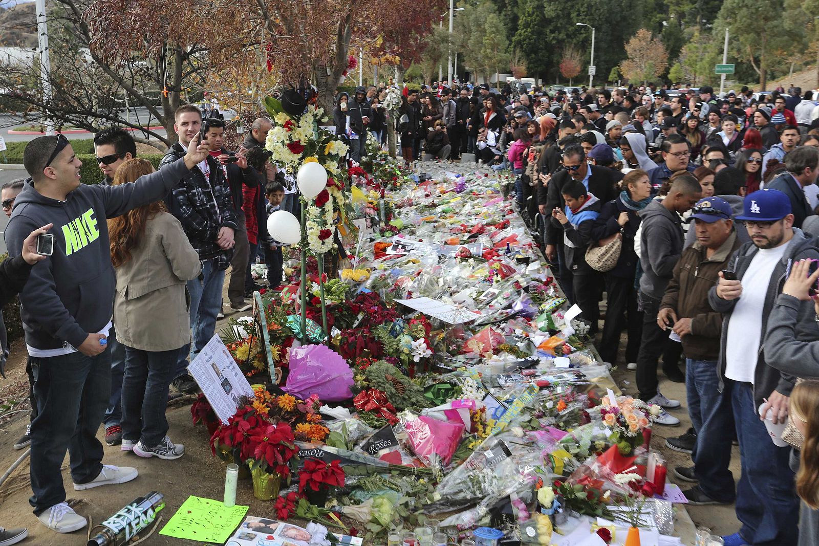 Crowds gather at an unofficial memorial event for "Fast & Furious" star Walker in Santa Clarita