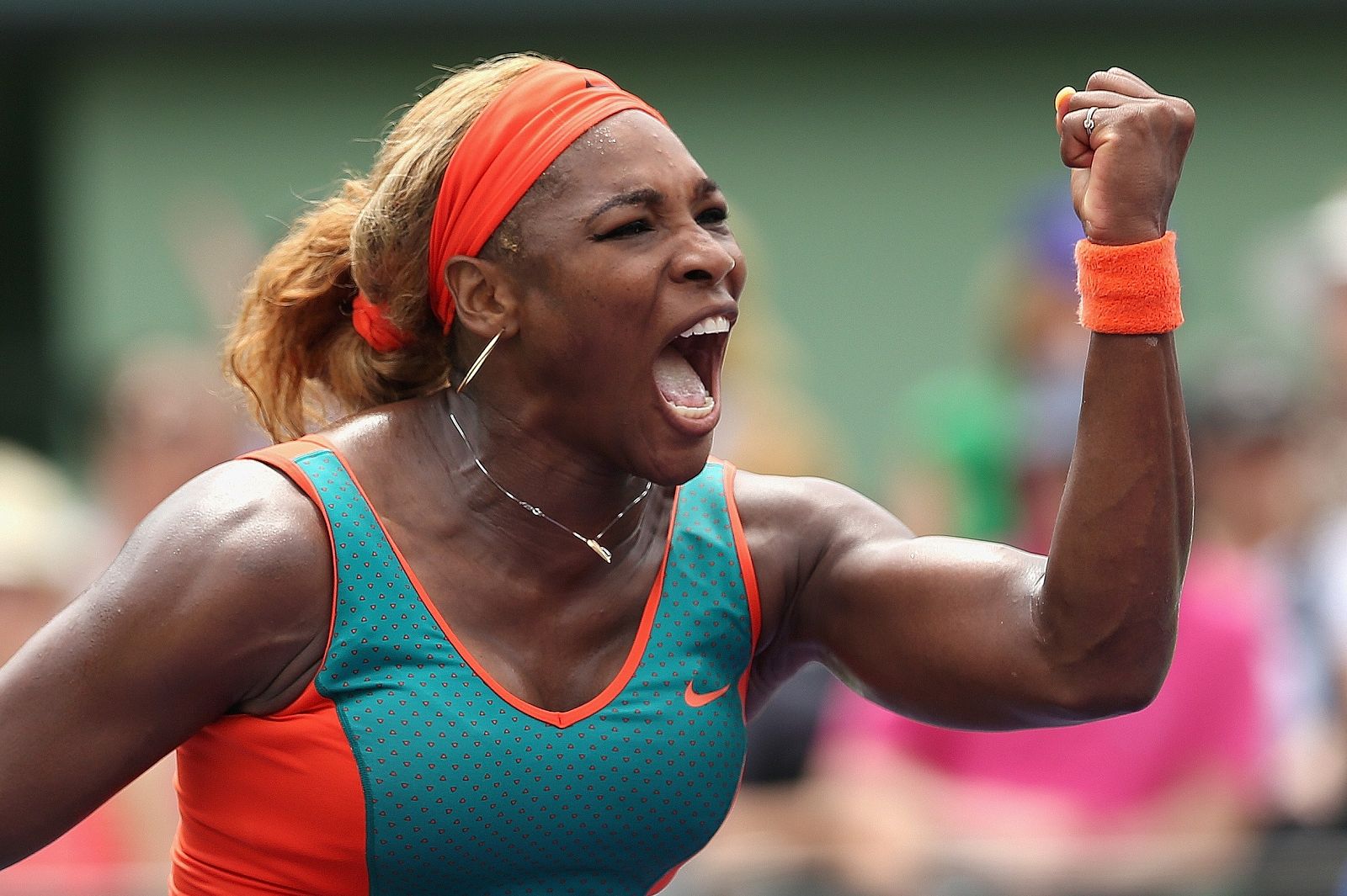 Serena Williams celebra ante la china Li Na