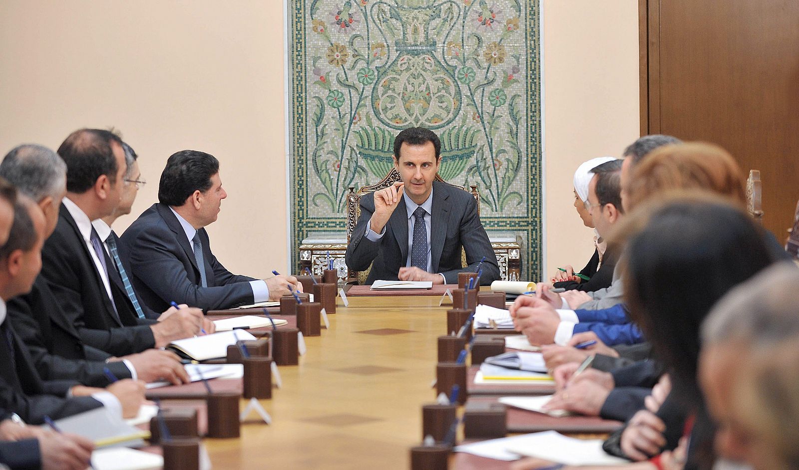 Syrian President Bashar al-Assad meets with members of the Higher Committee for Relief