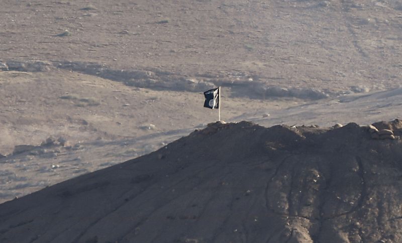 Black flag belonging to the Islamic State is seen near the Syrian town of Kobani, as pictured from the Turkish-Syrian border near the southeastern town of Suruc in Sanliurfa province