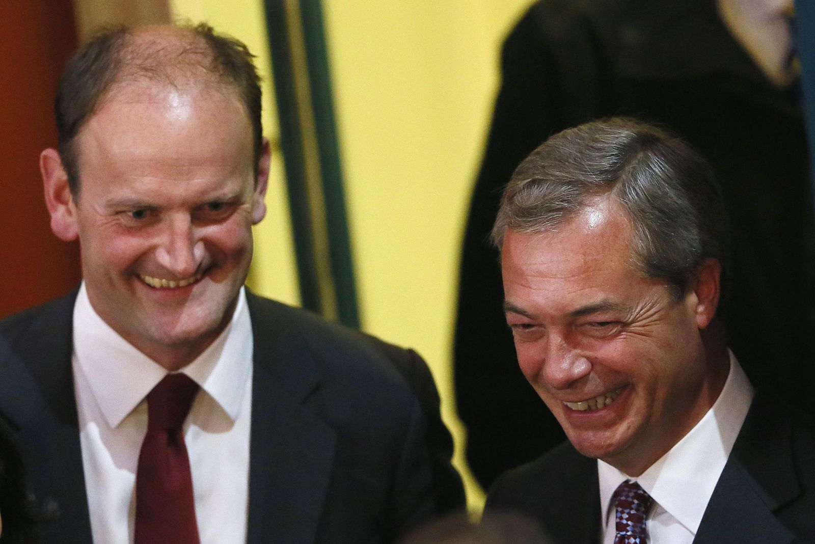 UKIP candidate Carswell and UKIP leader Farage react at the Town Hall in Clacton-on-Sea in eastern England