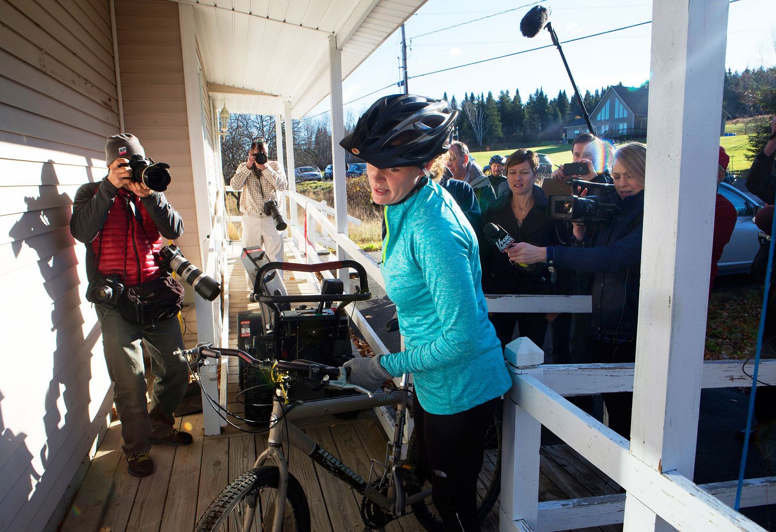 Kaci Hickox returns to her home surrounded by media after going for a bike ride with boyfriend Ted Wilbur in Fort Kent