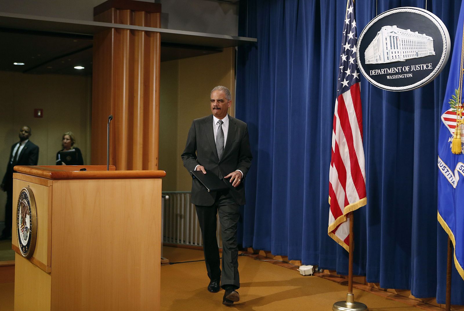 U.S. Attorney General Holder arrives to makes a statement about the grand jury decision not to seek an indictment in the Staten Island death of Eric Garner during an arrest in July, in Washington
