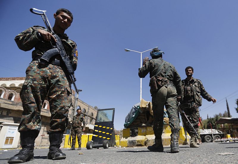 Police troopers secure the entrance of the U.S. embassy in Sanaa