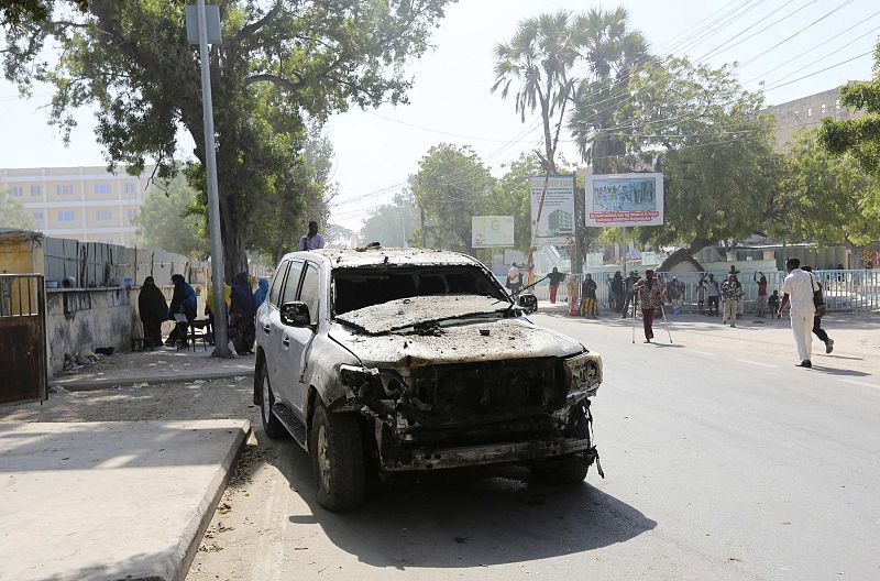 The wreckage of a car destroyed in a blast is seen near the Central Hotel after a suicide attack in Mogadishu