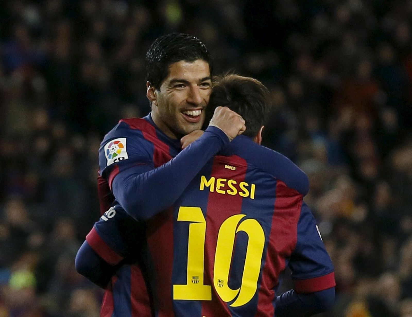 Messi y Suárez celebran el triunfo contra el Almería.