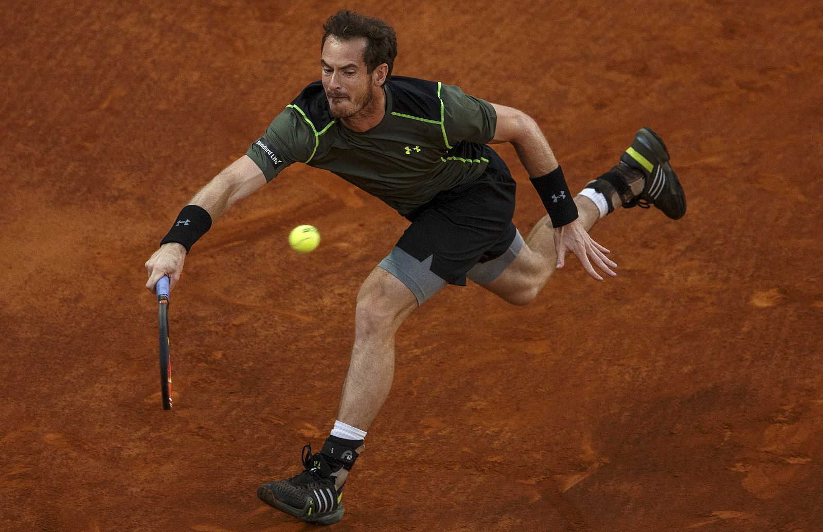 Britain's Murray returns a forehand to Canada's Raonic during their quarterfinal match at the Madrid Open tennis tournament in Madrid