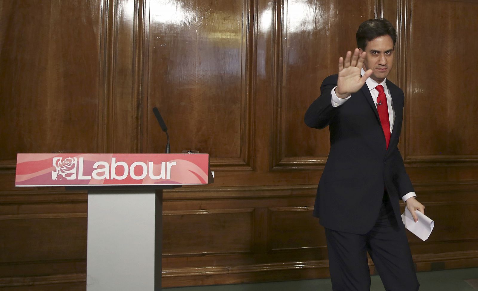 Britain's opposition Labour Party leader Ed Miliband waves after announcing his resignation as leader at a news conference in London