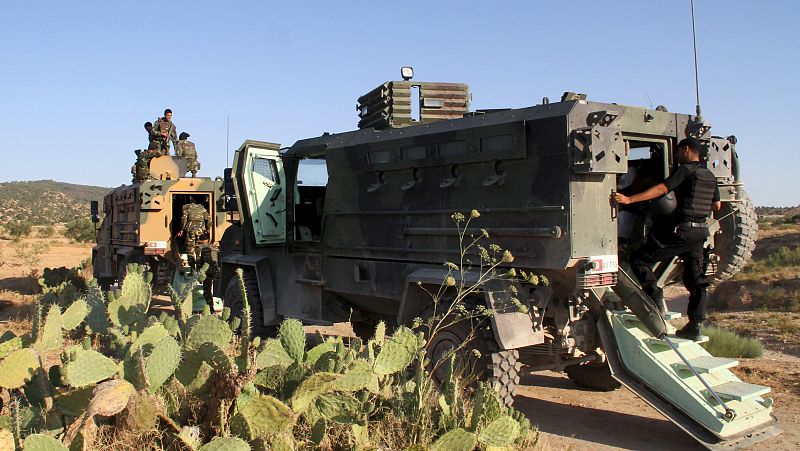 Tunisian soldiers and police patrol the area of Mount Salloum near Algeria's border in Kasserine