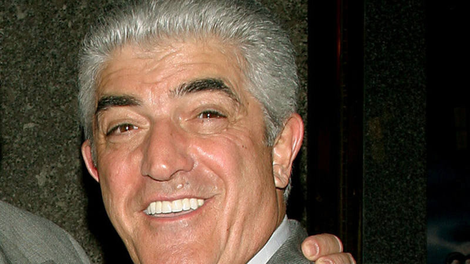 FILE PHOTO -  Actors Vincent Pastore (L) and Frank Vincent point at the photographers as they arrive for the fifth season premiere of the HBO series "The Sopranos," in New York