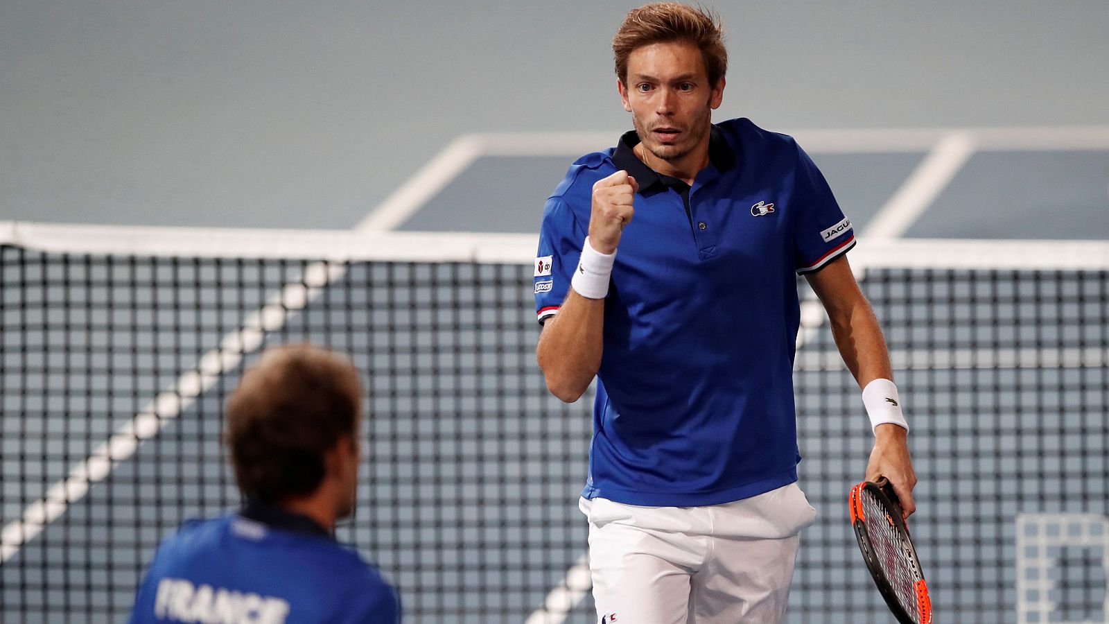 Nicolas Mahut, en primer término, celebra un punto con su compañero Julien Benneteau.