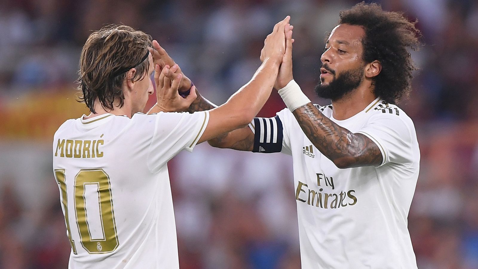 Modric y Marcelo celebran el primer gol del Madrid en Roma.