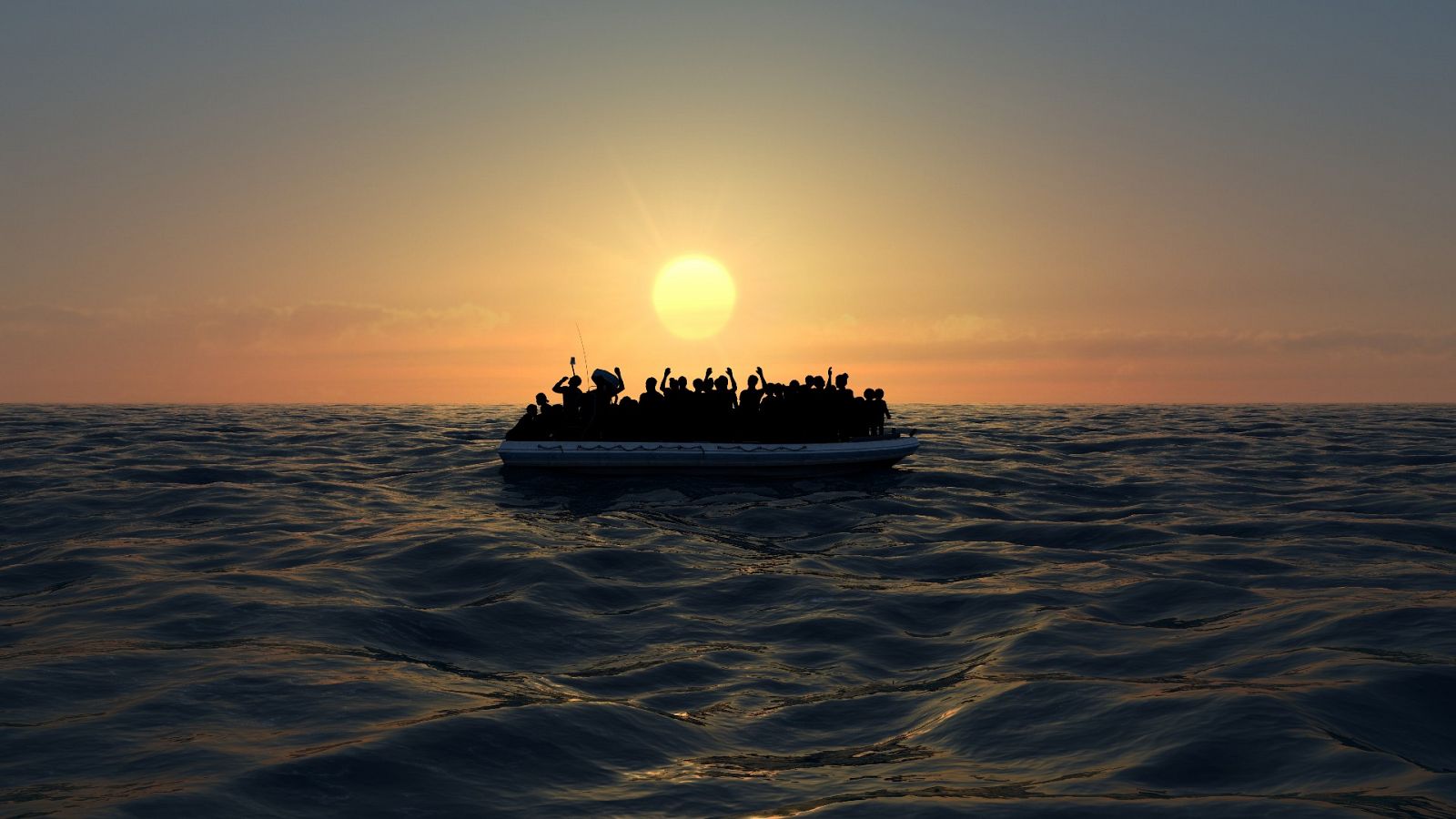 Una embarcación con migrantes en medio del mar