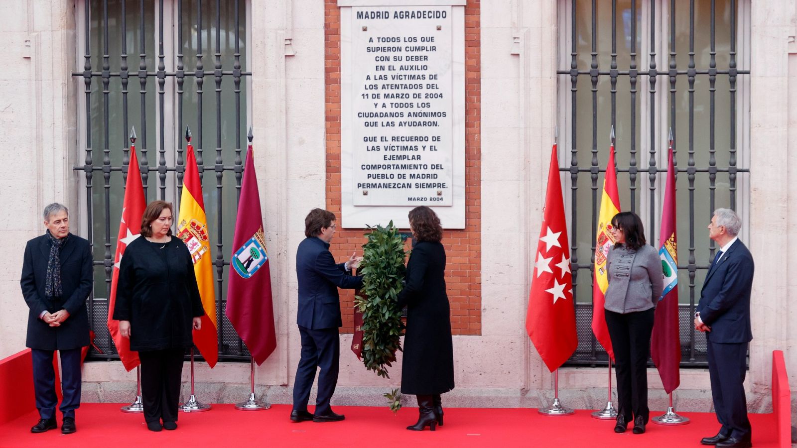 Isabel Díaz Ayuso y José Luis Martínez Almeida, durante el acto en recuerdo del 11M