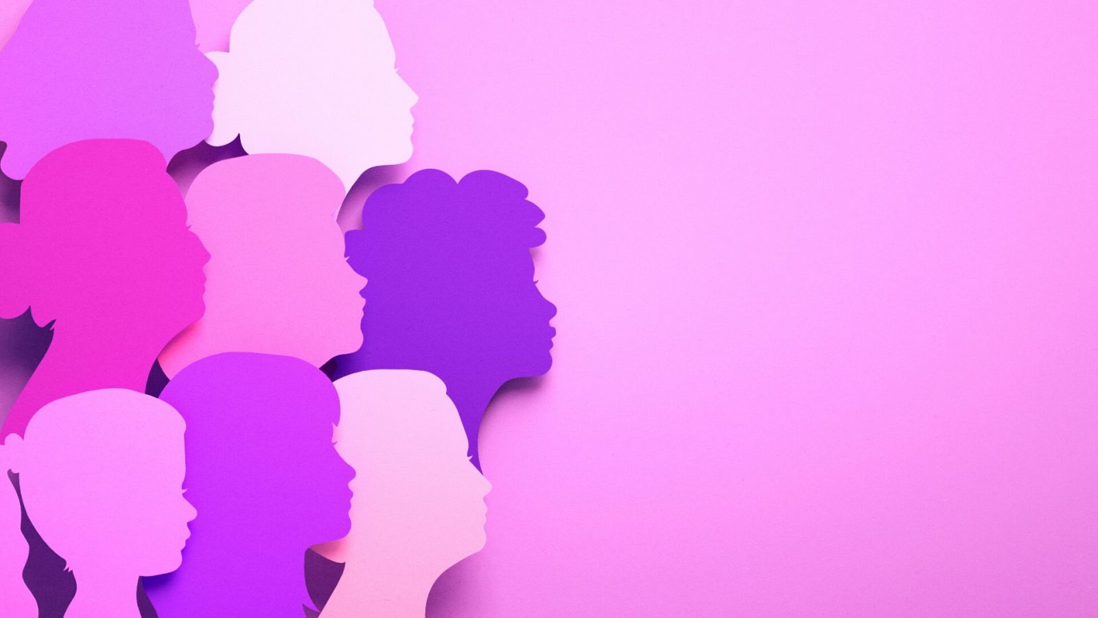 Un grupo de siluetas de mujeres en tonos rosas