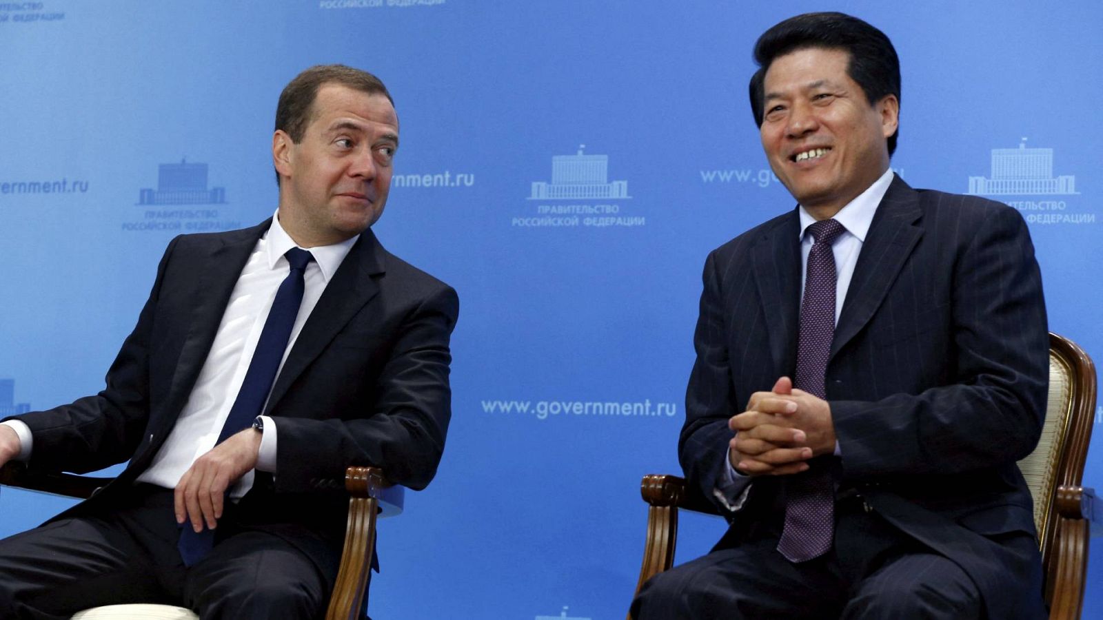 FILE PHOTO: Li Hui , then China's ambassador to Moscow, sat with Russian Prime Minister Dmitry Medvedev in 2015