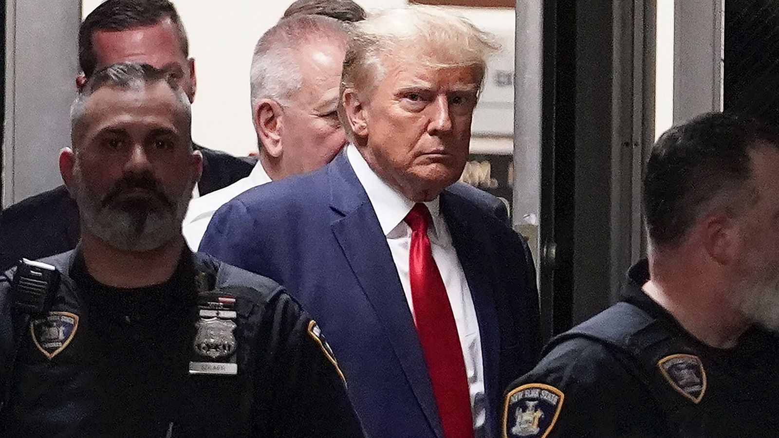 Donald Trump en una imagen de archivo custodiado por la policía