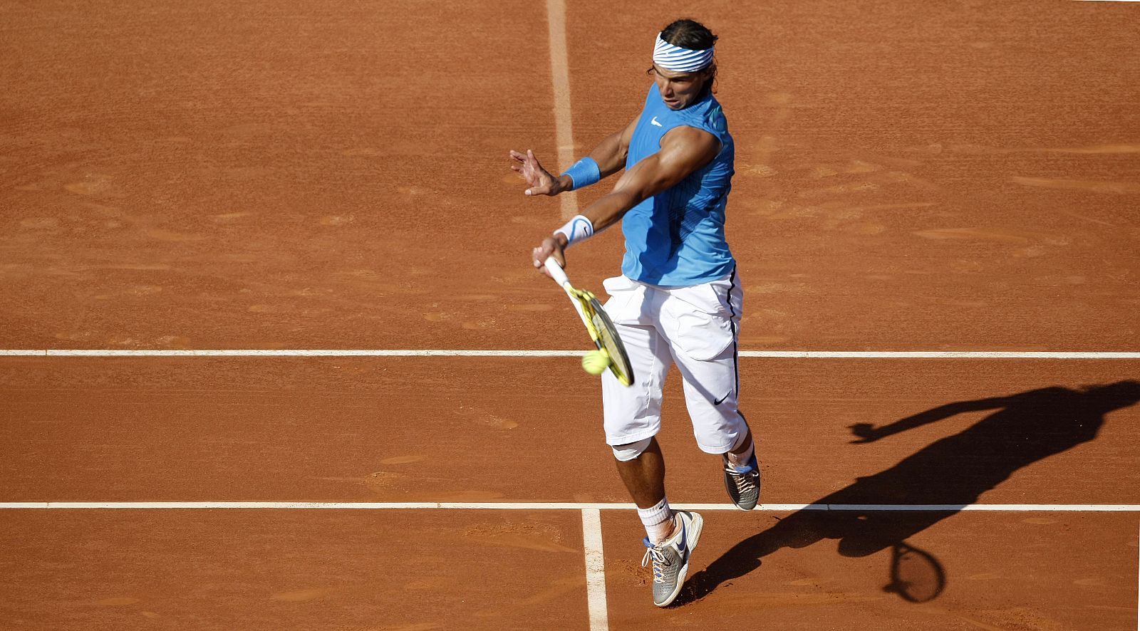 Nadal of Spain returns a ball to compatriot Ferrer during their final match at the Barcelona Open tennis tournament